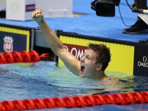 True Sweetser celebrates after winning the men's 1,500-meter freestyle at the U.S. swimming championships in Indianapolis, Tuesday, June 27, 2017. (AP Photo/Michael Conroy)