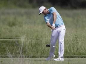 Russell Henley hits on the second tee during the fourth round of the U.S. Open golf tournament Sunday, June 18, 2017, at Erin Hills in Erin, Wis. (AP Photo/Chris Carlson)