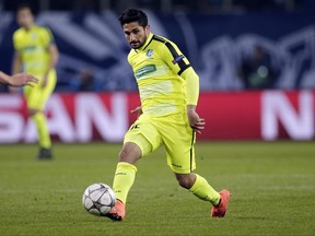 FILE - In this March 8, 2016, file photo, Gent's Kenny Saief plays the ball during a Champions League round of sixteen second leg soccer match against VfL Wolfsburg in Wolfsburg, Germany. Saief has been given permission by FIFA to change his national team affiliation to the United States from Israel. The announcement was made by the U.S. Soccer Federation on Thursday, June 22, 2018. The 23-year-old from Panama City, Fla., played for Israel's under-19 and under-21 teams.  (AP Photo/Michael Sohn, File)