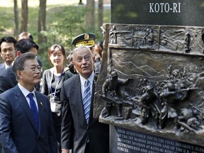 South Korean President Moon Jae-in, left, walks around the "Chosin Few Battle Monument," with former Marine Corps Lt. Gen. Stephen Olmstead, right, at the National Museum of the Marine Corps, Wednesday, June 28, 2017, in Triangle, Va. (AP Photo/Alex Brandon)
