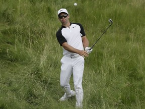 Paul Casey of England hits out of the rough on the 14th hole during the second round of the U.S. Open on Friday at Erin Hills in Erin, Wis.