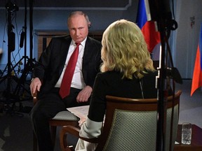Russian President Vladimir Putin faces Megyn Kelly during an interview with NBC's "Sunday Night with Megyn Kelly" in St. Petersburg, Russia.
