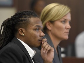 Brandon E. Banks and his attorney Katie Hagan listen during the Vanderbilt rape case trial at Justice A. A. Birch Building Monday, June 19, 2017, in Nashville, Tenn. Banks is charged with five counts of aggravated rape and two counts of aggravated sexual battery.  (Lacy Atkins/The Tennessean via AP, Pool)