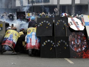 The young artist said he was inspired when he got word that a childhood friend had been killed in one of the protests that broke out against the government of Nicolas Maduro. (AP Photo/Fernando Llano)