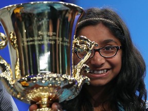 12 year old Ananya Vinay of Fresno, CA. holds her trophy after winning the 2017 Scripps National Spelling Bee by spelling the word "marocain", at Gaylord National Resort & Convention Center June 1, 2017 in National Harbor, Maryland.