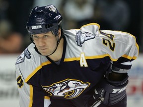 In this Jan. 10, 2006 file photo, Nashville Predators forward Scott Walker lines up for a face-off against the New York Islanders.