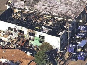 FILE- This Dec. 3, 2016 file image from video provided by KGO-TV shows the Ghost Ship Warehouse after a fire swept through the Oakland, Calif., building. More than six months after the Dec. 2 blaze at the warehouse that authorities said was illegally converted into living quarters, the Oakland Fire Department has released a 50-page report filled with harrowing details of death and panic as the flames and deadly smoke spread. The report contains many previously unknown details about the nation's deadliest structure fire in more than 14 years and says investigators could not determine the cause of the blaze due to extensive fire damage. (KGO-TV via AP, File)