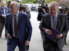 B.C. NDP leader John Horgan and B.C. Green party leader Andrew Weaver arrive at Government House to drop of a signed document by 44 MLAs showing theres an agreement between the two parties in Victoria, B.C., on Wednesday, May 31, 2017.