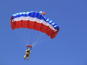 A federal smokejumper participates in a practice jump west of Albuquerque, N.M., on June 29, 2017. Federal agencies called for a boost in the number of resources in the Southwest due to the persistent fire danger, resulting in smokejumpers from Idaho and Montana being assigned to the region. (AP Photo/Susan Montoya Bryan)