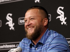 Former Chicago White Sox pitcher Mark Buehrle smiles as he responds to a question about his career as a White Sox during a news conference before a baseball game between his former ball club and the Oakland Athletics Friday, June 23, 2017, in Chicago. Buehrle will see his No. 56 retired during ceremonies before Saturday's game. (AP Photo/Charles Rex Arbogast)