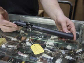 In this Jan. 31, 2017, photo, a firearm suppressor is on display at a gun shop in Stockbridge, Georgia. Gun rights advocates entered the Trump era with high hopes. After years of frustration they thought a gun-friendly president and Congress would advance their agenda.  (AP Photo/Lisa Marie Pane)