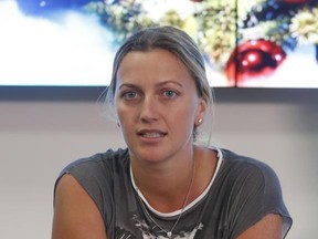 FILE - In this Friday, Dec. 23, 2016, file photo, Czech Republic's tennis player Petra Kvitova makes a statement to the media in Prague, Czech Republic. Kvitova still has not regained full strength in her left hand, the one she uses to swing a tennis racket _ and the one that was stabbed by an attacker at her home in December.  (AP Photo/Petr David Josek, file)