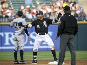 Chicago White Sox's Yolmer Sanchez (5) celebrates after hitting a double against the New York Yankees during the second inning of a baseball game Tuesday, June 27, 2017, in Chicago. (Armando L. Sanchez/Chicago Tribune via AP)