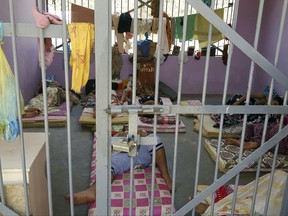 Prisoners lie in a newly renovated cell in Aden Central Prison, known as Mansoura, in this May 9, 2017 photo in Aden, Yemen. Another, closed section of the prison is part of a network of secret detention facilities run by the United Arab Emirates and its Yemeni allies, into which hundreds arrested on suspicion of al-Qaida links have disappeared. Some have been flown to an Emirati base in the nearby Horn of Africa, and some have been interrogated by American officials, witnesses said. (AP Photo/Maad El Zikry)