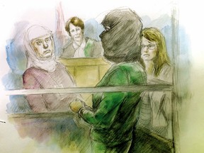 Left to right: An Arab interpreter, Justice of the Peace Alice Napier, Rehab Dughmosh and  Crown attorney Candice Suter at College Park court on June 6, 2017