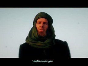 This screen-grab of proof-of-life undated video posted online by recently formed militant group Nusrat al-Islam wal Muslimeen, shows South African hostage Stephen McGowan in an unknown location, with a caption reading in Arabic 'My name is Stephen McGowan.'