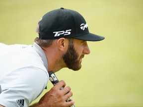 Dustin Johnson lines up a putt at the British Open on July 23.