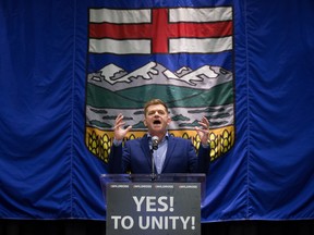 Wildrose leader Brian Jean gives a speech after it was announced that the Wildrose party had voted in favour of uniting with the Progressive Conservatives, in Red Deer Saturday July 22, 2017.