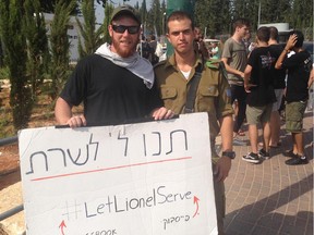 Canadian man Lionel Kalles poses with a supporter. He has been protesting in Tel Aviv, demanding that the Israeli military allow him to serve.