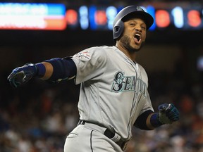 Robinson Cano of the Seattle Mariners and the American League celebrates after hitting a home run in the 10th inning against the National League during the 88th MLB All-Star Game at Marlins Park in Miami on Tuesday night.