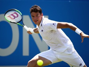 Milos Raonic plays a shot at the Aegon Championships in London, England, on June 20.