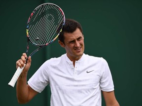 Australia's Bernard Tomic reacts against Germany's Mischa Zverev during their men's singles first round match on the second day of the 2017 Wimbledon Championships at The All England Lawn Tennis Club in Wimbledon, southwest London, on July 4, 2017.