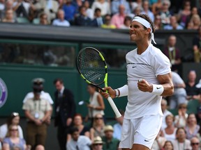 Spain's Rafael Nadal celebrates beating Russia's Karen Khachanov during their men's singles third round match on the fifth day of the 2017 Wimbledon Championships at The All England Lawn Tennis Club in Wimbledon, southwest London, on July 7, 2017.