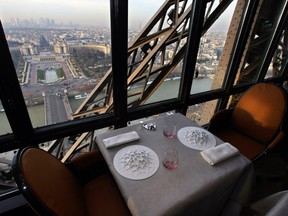 A table set up at the restaurant Jules Vernes up the Eiffel tower in Paris.  French President Emmanuel Macron will host US President Donald Trump for talks on July 13, before heading to dinner at the Michelin-starred restaurant 'Le Jules Verne' up on the Eiffel Tower. Trump is slated to be Macron's guest of honour at the July 14 Bastille Day parade in Paris, which will mark 100 years since America entered World War I on France's side.