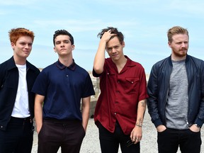 (From L) British actor Tom Glynn-Carney, British actor Fionn Whitehead, British singer, songwriter and actor Harry Styles and British actor Jack Lowden pose on July 16, 2017, during a photo-call in Dunkirk, ahead of the release of the movie Dunkirk on July 19, 2017.