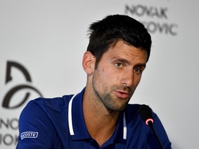 Serbian tennis player Novak Djokovic delivers a press conference in Belgrade on July 26, 2017. Djokovic will miss the rest of the season with an elbow injury, he announced.