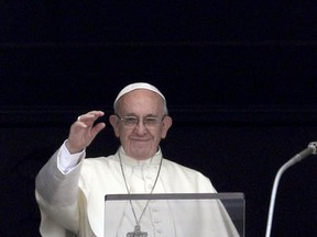 Pope Francis recites the Angelus noon prayer from the window of his studio overlooking St.Peter's Square, at the Vatican, Sunday, July 23, 2017. (AP Photo/Andrew Medichini)