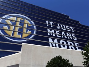 The SEC logo is shown outside of the Hyatt Regency hotel for the NCAA college football Southeastern Conference's annual media gathering, Monday, July 10, 2017, in Hoover, Ala. (AP Photo/Butch Dill)