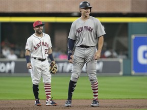 New York Yankees' Aaron Judge, right, and Houston Astros second baseman Jose Altuve have a conversation during the first inning of a baseball game, Sunday, July 2, 2017, in Houston. Both players have been elected to start in the All-Star Game in Miami on July 12, 2017.