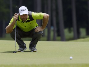 Chad Collins prepares to putt on the 16th hole during the second round of the Barbasol Championship golf tournament at Grand National Golf Course in Opelika, Ala., Friday, July 21, 2017. Collins missed a chance for the 10th sub-60 round in PGA Tour history and third of the season, parring the final two holes for an 11-under 60. (Todd J. Van Emst/Opelika-Auburn News via AP)