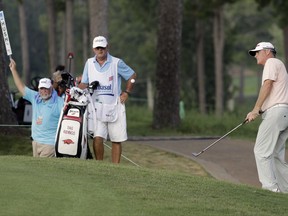Tag Riding, right, chips to the green on 18 during the third round of the Barbasol Championship golf tournament Saturday, July 22, 2017, in Opelika, Ala. (Todd J. Van Emst/Opelika-Auburn News via AP)