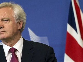 FILE -In this Monday June 19, 2017 file photo, British Secretary of State for Exiting the EU David Davis listens to opening remarks during his arrival at EU headquarters in Brussels. U.K. and European Union negotiators should be able to move from talks about Britain's divorce terms to negotiating future relations before the end of the year, the top U.K. Brexit official said Tuesday, July 11, 2017. (AP Photo/Virginia Mayo, File)