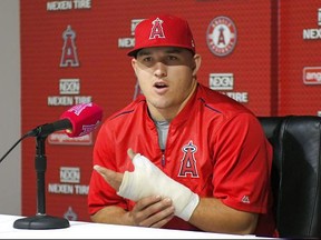 FILE - In this June 3, 2017, file photo, Los Angeles Angels' Mike Trout speaks about his injured left thumb during a news conference prior to the team's baseball game against the Detroit Tigers in Anaheim, Calif. American League MVP Trout will miss the All-Star Game while rehabilitating the thumb. (AP Photo/Mark J. Terrill, File)