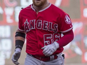 Los Angeles Angels' Kole Calhoun (56) rounds the bases after hitting a solo home run off Minnesota Twins starting pitcher Ervin Santana during the first inning of a baseball game, Wednesday, July 5, 2017, in Minneapolis. (AP Photo/Paul Battaglia)