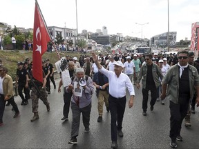 Some thousands of people follow Kemal Kilicdaroglu, front-center, the leader of Turkey's main opposition Republican People's Party, on his 400-kilometer (250-mile) "March for Justice", in the outskirts of Istanbul, Saturday, July 8, 2017.  The march, from the capital Ankara to an Istanbul prison, began to denounce the imprisonment of a party lawmaker but has grown into a wider protest of Turkey's President Recep Tayyip Erdogan's policies and the large-scale government crackdown on opponents in the wake of July 2016's failed coup attempt. (AP Photo)