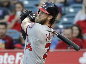 Washington Nationals' Bryce Harper watches his home run against the Los Angeles Angels during the first inning of a baseball game in Anaheim, Calif., Tuesday, July 18, 2017. (AP Photo/Chris Carlson)