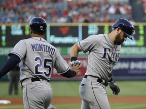 Tampa Bay Rays' Evan Longoria, right, is greeted by third base coach Charlie Montoyo after hitting a home run during the first inning of the team's baseball game against the Los Angeles Angels, Friday, July 14, 2017, in Anaheim, Calif. (AP Photo/Jae C. Hong)