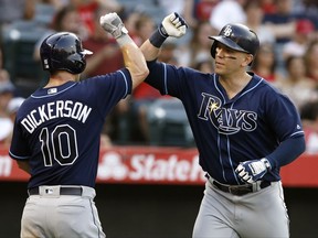 Tampa Bay Rays' Logan Morrison, right, celebrates with Corey Dickerson after Morrison's two-run home run during the third inning of the team's baseball game against the Los Angeles Angels in Anaheim, Calif., Saturday, July 15, 2017. (AP Photo/Alex Gallardo)