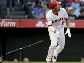 Los Angeles Angels' Andrelton Simmons watches his two-run home run against the Boston Red Sox during the third inning of a baseball game in Anaheim, Calif., Saturday, July 22, 2017. (AP Photo/Chris Carlson)