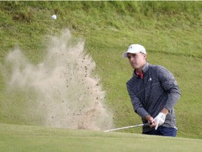 Jordan Spieth of the United States plays out of a bunker on the 17th hole during the third round of the British Open Golf Championship, at Royal Birkdale, Southport, England, on Saturday.