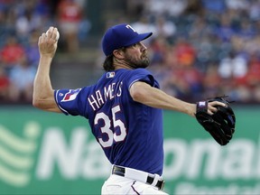 Texas Rangers' Cole Hamels throws to the Miami Marlins during the first inning of a baseball game, Tuesday, July 25, 2017, in Arlington, Texas. (AP Photo/Tony Gutierrez)