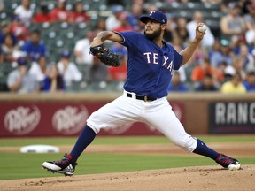 Texas Rangers starting pitcher Martin Perez (33) throws during the first inning of a baseball game against the Miami Marlins, Monday, July 24, 2017, in Arlington, Texas. (AP Photo/Jeffrey McWhorter)