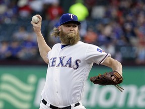 Texas Rangers starting pitcher Andrew Cashner throws to the Baltimore Orioles in the first inning of a baseball game, Friday, July 28, 2017, in Arlington, Texas. (AP Photo/Tony Gutierrez)