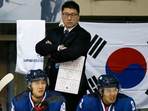 In this Feb. 22, 2017 photo, South Korea head coach Jim Paek watches from the bench during a game against Kazakhstan at the Asian Winter Games in Japan.