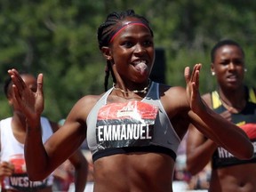 In this July 9 file photo, Crystal Emmanuel celebrates her 200-metre gold medal at the Canadian championships in Ottawa.