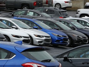 In this Thursday, Jan. 12, 2017, photo, Chevrolet cars sit on the lot of a dealer in Pittsburgh. On Monday, July 3, 2017, automakers release monthly sales reports. (AP Photo/Gene J. Puskar)